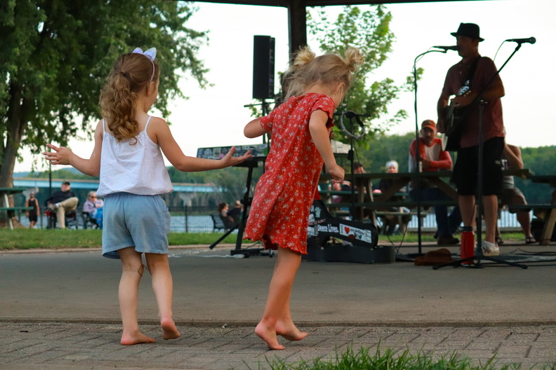 people dancing concert park island music